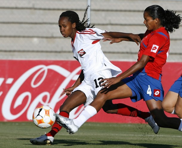 #12 Trinidad & Tobago striker Ahkeela Mollon (L) battles for the ball with Costa Rica's defender Karol Galvez during the first round in their CONCACAF Women's Olympic Qualification soccer match at the Benito Juarez stadium in Ciudad Juarez, April 4, 2008.